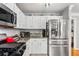 Kitchen features stainless steel appliances, granite countertops, and ample storage space at 981 Cobb Place Manor Dr, Marietta, GA 30066