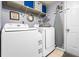 Well-equipped laundry room with modern appliances and storage shelves at 981 Cobb Place Manor Dr, Marietta, GA 30066