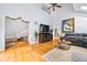 Bright and airy living room featuring a fireplace, hardwood floors, and ample natural light at 981 Cobb Place Manor Dr, Marietta, GA 30066