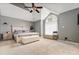 Spacious bedroom with vaulted ceilings, large window, and neutral decor at 981 Cobb Place Manor Dr, Marietta, GA 30066