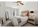 Bedroom with a neutral color scheme, ceiling fan, and light colored furniture at 1205 New Haven Ct, Roswell, GA 30075