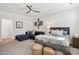 Comfortable bedroom with seating area, ceiling fan, and ensuite access at 1205 New Haven Ct, Roswell, GA 30075