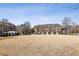Attractive townhome community with green space and well-maintained landscaping at 1205 New Haven Ct, Roswell, GA 30075