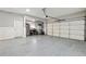 Spacious garage with epoxy flooring and storage at 1205 New Haven Ct, Roswell, GA 30075