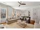 Well lit living room with second-floor overlook and hardwood flooring at 1205 New Haven Ct, Roswell, GA 30075