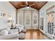 Cozy sunroom with wood ceiling, natural light, and comfortable seating at 1205 New Haven Ct, Roswell, GA 30075
