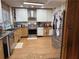 Kitchen featuring stainless steel appliances, granite counters, and custom cabinets at 2820 Bluebird Cir, Duluth, GA 30096
