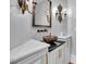 Elegant bathroom featuring decorative bowl sink, granite countertop, and ornate sconces at 939 Middle Fork Trl, Suwanee, GA 30024