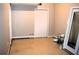 View of an unfinished basement with bare floor, white door, and mechanicals at 235 Woodland Way, Canton, GA 30114