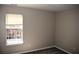 Bedroom with a window view, carpet floors, and a neutral color at 235 Woodland Way, Canton, GA 30114