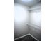 Walk-in closet featuring white wire shelving for optimal storage space at 235 Woodland Way, Canton, GA 30114