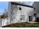 View of the home's rear exterior with a fenced yard, patio, and ample outdoor space at 235 Woodland Way, Canton, GA 30114