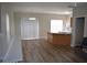 View of a living room featuring wood floors, fireplace, breakfast bar, and a sliding glass door at 235 Woodland Way, Canton, GA 30114
