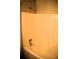Bright bathroom shower and tub area featuring an updated shower head and tub faucet at 235 Woodland Way, Canton, GA 30114