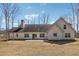 The back of the home features a patio and a spacious yard at 40 Oak Forest Dr, Oxford, GA 30054