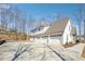 Three-car garage offers ample parking and storage, with a large concrete driveway for easy access at 40 Oak Forest Dr, Oxford, GA 30054