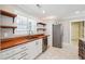 Well-lit kitchen with butcher block counters, stainless steel appliances, and ample storage for a functional space at 40 Oak Forest Dr, Oxford, GA 30054