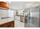 Well-lit kitchen features stainless steel appliances, white cabinets, and a wood countertop at 40 Oak Forest Dr, Oxford, GA 30054