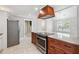 Spacious kitchen island with wood cabinets, stainless steel oven, and ample countertop space for cooking and entertaining at 40 Oak Forest Dr, Oxford, GA 30054