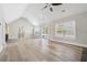 Sun-filled living room boasts hardwood floors, a sliding glass door, and many windows at 40 Oak Forest Dr, Oxford, GA 30054