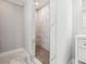 New walk-in shower featuring marble tiling, and an integrated shower bench at 40 Oak Forest Dr, Oxford, GA 30054