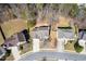 This is an aerial view of a charming neighborhood with mature trees, a beautiful landscape, and privacy at 5729 Newnan Cir, Austell, GA 30106