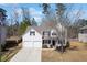 Charming two-story home featuring a two car garage and manicured lawn at 5729 Newnan Cir, Austell, GA 30106
