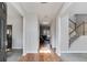 Inviting foyer featuring hardwood floors, staircase, and a view to the living room at 5729 Newnan Cir, Austell, GA 30106