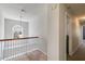 Open hallway with hardwood railing, carpet and natural light at 5729 Newnan Cir, Austell, GA 30106