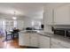 Modern kitchen with granite counters, stainless steel microwave, and an open layout at 5729 Newnan Cir, Austell, GA 30106