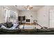 Spacious living room featuring a fireplace, hardwood floors, and plush leather seating at 5729 Newnan Cir, Austell, GA 30106