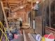 Barn interior with wood beam structure, stalls, and equipment at 8470 Wallace Tatum Rd, Cumming, GA 30028