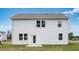 Exterior rear view of home with white siding and windows and green yard at 201 Groveton Ct, Euharlee, GA 30145