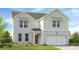 Charming two-story home featuring a brick and siding facade, complemented by a well-manicured front yard at 201 Groveton Ct, Euharlee, GA 30145