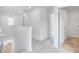 Upstairs hallway with gray carpet, white walls, and access to carpeted and wood laminate rooms at 201 Groveton Ct, Euharlee, GA 30145