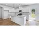 Modern kitchen featuring white cabinets, stainless steel appliances, granite countertops and a kitchen island at 201 Groveton Ct, Euharlee, GA 30145