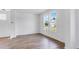 Bright living room featuring wood floors, white walls, and large windows at 201 Groveton Ct, Euharlee, GA 30145