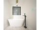 Elegant freestanding bathtub with black fixtures in a bright, modern bathroom setting at 264 Haas Ave, Atlanta, GA 30316