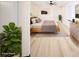 A bright bedroom with a ceiling fan, natural light, neutral decor, and hardwood floors at 264 Haas Ave, Atlanta, GA 30316