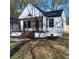 Charming home with modern farmhouse design, covered front porch, and well-maintained lawn at 264 Haas Ave, Atlanta, GA 30316