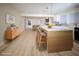 Open kitchen with a large island, white cabinets, modern pendant lighting and stainless steel appliances at 264 Haas Ave, Atlanta, GA 30316