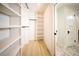 Organized walk-in closet with custom shelving and storage solutions for clothing and accessories at 264 Haas Ave, Atlanta, GA 30316