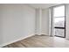 Modern bedroom featuring light-colored wood floors and a large window at 375 Ralph Mcgill Blvd # 601, Atlanta, GA 30312
