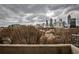 Balcony view of the city skyline and tree-lined neighborhood at 375 Ralph Mcgill Blvd # 601, Atlanta, GA 30312