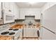 Cozy kitchen featuring white cabinets, butcher block countertops, and modern appliances at 375 Ralph Mcgill Blvd # 601, Atlanta, GA 30312