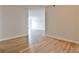 Open-concept living room featuring laminate floors, neutral paint, and access to outdoor balcony at 375 Ralph Mcgill Blvd # 601, Atlanta, GA 30312