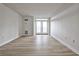 Expansive living room featuring laminate floors, and balcony access with views at 375 Ralph Mcgill Blvd # 601, Atlanta, GA 30312