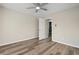 Bright bedroom showcasing ceiling fan, neutral walls, wood-look flooring and full size closet at 841 Lake Hollow Sw Blvd, Marietta, GA 30064