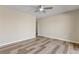 Spacious bedroom showcasing ceiling fan, neutral walls, and attractive wood-look flooring at 841 Lake Hollow Sw Blvd, Marietta, GA 30064