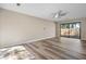 Inviting living room filled with natural light, ceiling fan and sliding door to back patio at 841 Lake Hollow Sw Blvd, Marietta, GA 30064